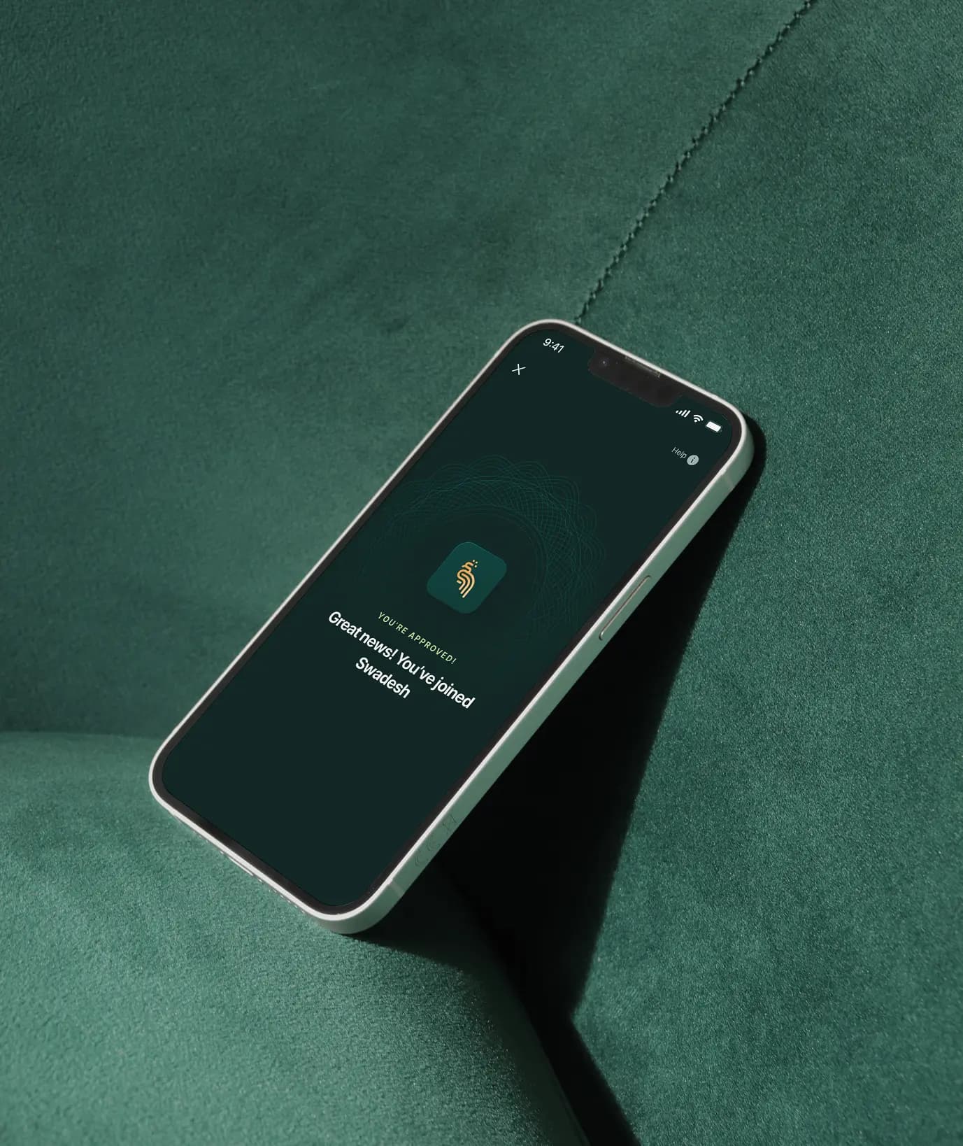Swadesh — Phone mockup on green fabric